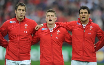 02.10.11 - Wales v Fiji - Rugby World Cup 2011 - Ryan Jones, Scott Williams and Mike Phillips during the national anthems. 