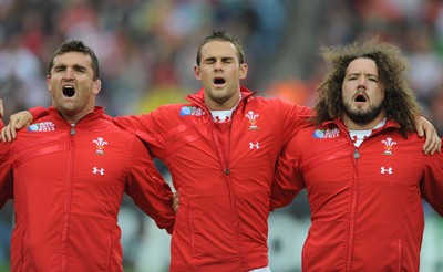 02.10.11 - Wales v Fiji - Rugby World Cup 2011 - Huw Bennett, Lee Byrne and Adam Jones during the national anthems. 