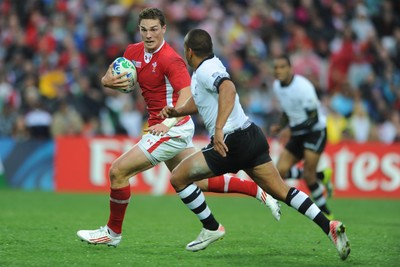 02.10.11 - Wales v Fiji - Rugby World Cup 2011 - George North of Wales is tackled by Vitori Buatava(R) of Fiji. 