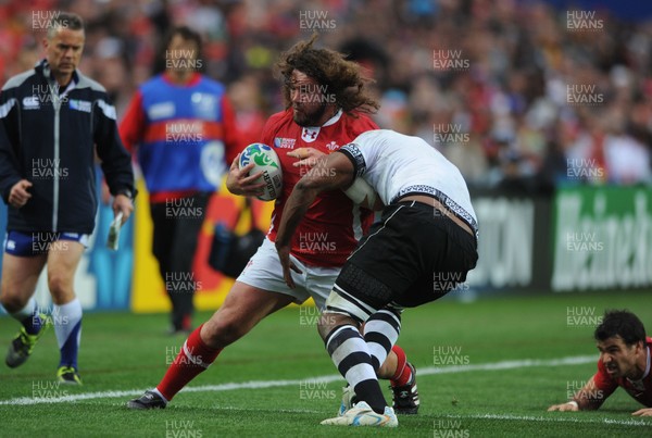 02.10.11 - Wales v Fiji - Rugby World Cup 2011 - Adam Jones of Wales takes on Leone Nakarawa of Fiji. 