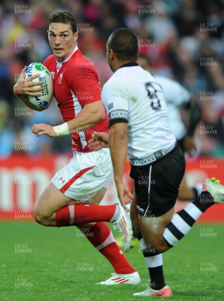 02.10.11 - Wales v Fiji - Rugby World Cup 2011 - George North of Wales is tackled by Vitori Buatava(R) of Fiji. 