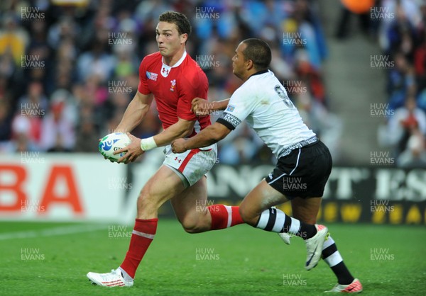 02.10.11 - Wales v Fiji - Rugby World Cup 2011 - George North of Wales is tackled by Vitori Buatava(R) of Fiji. 