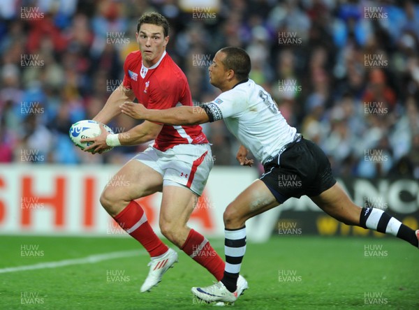 02.10.11 - Wales v Fiji - Rugby World Cup 2011 - George North of Wales is tackled by Vitori Buatava(R) of Fiji. 
