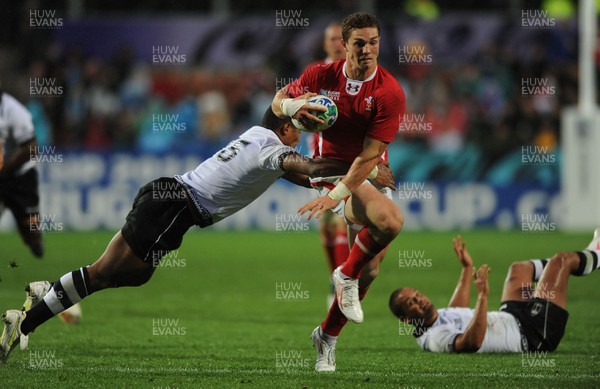 02.10.11 - Wales v Fiji - Rugby World Cup 2011 - George North of Wales breaks past Iliesa Keresoni of Fiji. 