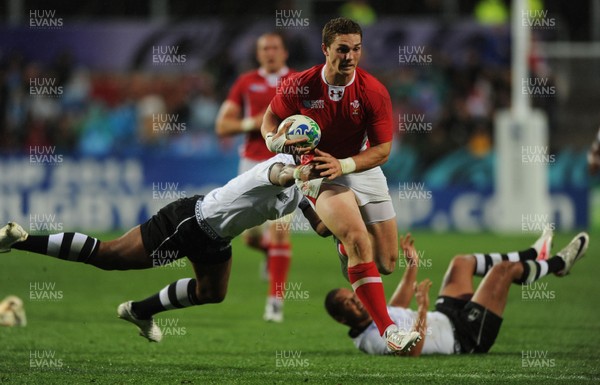 02.10.11 - Wales v Fiji - Rugby World Cup 2011 - George North of Wales breaks past Iliesa Keresoni of Fiji. 