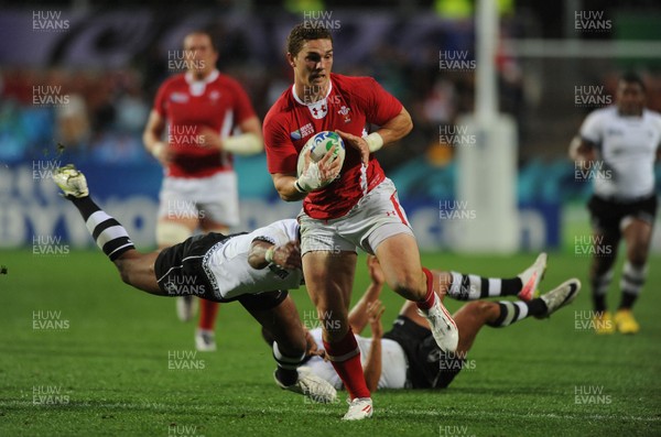 02.10.11 - Wales v Fiji - Rugby World Cup 2011 - George North of Wales breaks past Iliesa Keresoni of Fiji. 