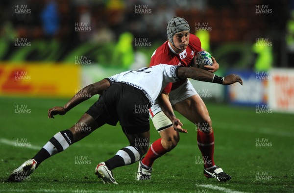 02.10.11 - Wales v Fiji - Rugby World Cup 2011 - Jonathan Davies of Wales takes on Vereniki Goneva of Fiji. 