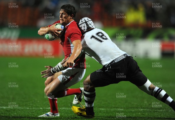 02.10.11 - Wales v Fiji - Rugby World Cup 2011 - Lloyd Williams of Wales is tackled by Mala Ravulo of Fiji. 