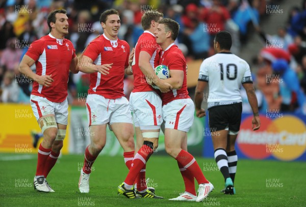 02.10.11 - Wales v Fiji - Rugby World Cup 2011 - Scott Williams of Wales celebrates his try with Rhys Priestland. 