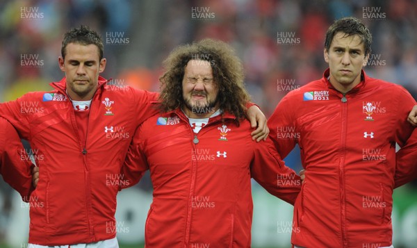 02.10.11 - Wales v Fiji - Rugby World Cup 2011 - Lee Byrne, Adam Jones and Ryan Jones during the national anthems. 