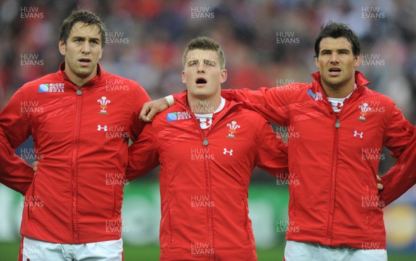 02.10.11 - Wales v Fiji - Rugby World Cup 2011 - Ryan Jones, Scott Williams and Mike Phillips during the national anthems. 