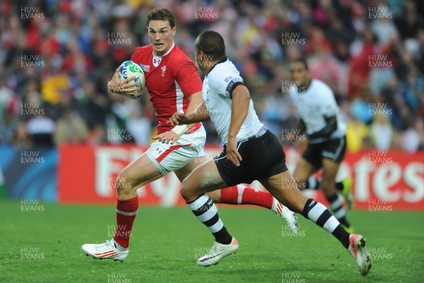 02.10.11 - Wales v Fiji - Rugby World Cup 2011 - George North of Wales is tackled by Vitori Buatava(R) of Fiji. 