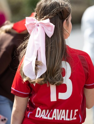 060925 - Wales v Fiji, Women’s Rugby World Cup - Wales fans sport pink bows as they wait for the team to arrive at the stadium ahead of the match