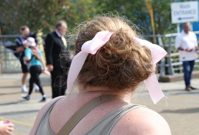 060925 - Wales v Fiji, Women’s Rugby World Cup - Wales fans sport pink bows as they wait for the team to arrive at the stadium ahead of the match