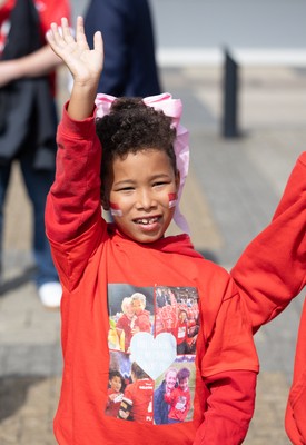 060925 - Wales v Fiji, Women’s Rugby World Cup - Wales fans sport pink bows as they wait for the team to arrive at the stadium ahead of the match