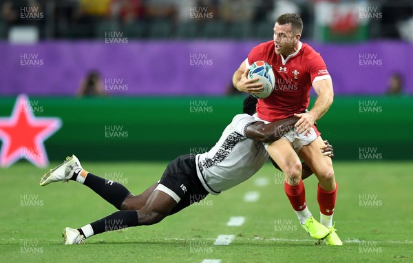 091019 - Wales v Fiji - Rugby World Cup - Pool D - Gareth Davies of Wales is tackled by Frank Lomani of Fiji