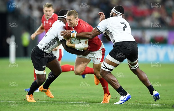 091019 - Wales v Fiji - Rugby World Cup - Pool D - Hadleigh Parkes of Wales is tackled by Levani Botia and Semi Kunatani of Fiji