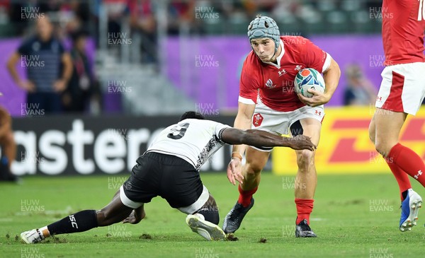 091019 - Wales v Fiji - Rugby World Cup - Pool D - Jonathan Davies of Wales is tackled by Frank Lomani of Fiji