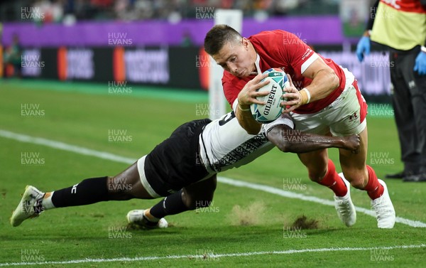 091019 - Wales v Fiji - Rugby World Cup - Pool D - Josh Adams of Wales is pushed into touch before he can ground the ball by Frank Lomani of Fiji