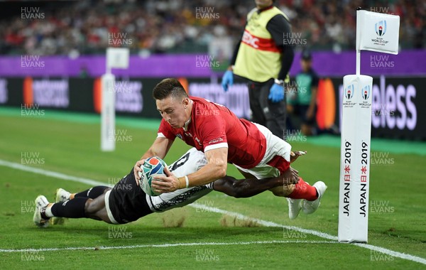 091019 - Wales v Fiji - Rugby World Cup - Pool D - Josh Adams of Wales is pushed into touch before he can ground the ball by Frank Lomani of Fiji