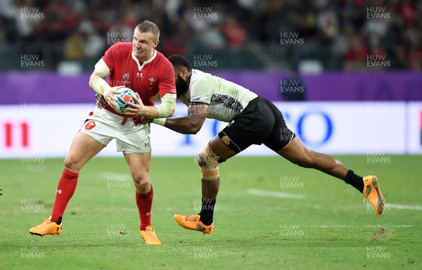 091019 - Wales v Fiji - Rugby World Cup - Pool D - Hadleigh Parkes of Wales is tackled by Waisea Nayacalevu of Fiji