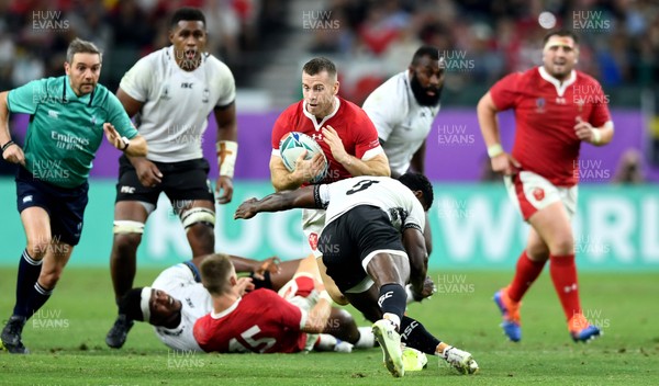 091019 - Wales v Fiji - Rugby World Cup - Gareth Davies of Wales is tackled by Frank Lomani of Fiji