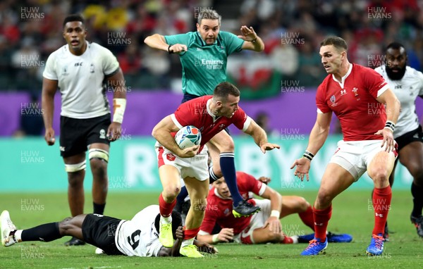 091019 - Wales v Fiji - Rugby World Cup - Gareth Davies of Wales is tackled by Frank Lomani of Fiji