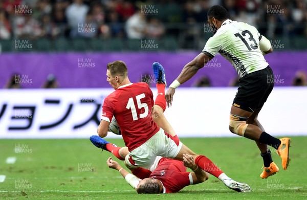 091019 - Wales v Fiji - Rugby World Cup - Liam Williams of Wales collides with Dan Biggar of Wales