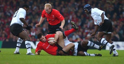 09.11.02  Wales v Fiji  Wales Mark Jones is tackled by Simon Raiwalui  