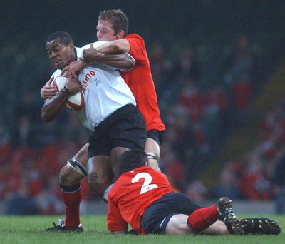 09.11.02  Wales v Fiji  Fiji's Seremaia Bai is tackled by Dafydd Jones and Mefin Davies   