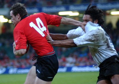 9-11-02 Wales v Fuji Wales Mark Jones hands off Nicky Little  