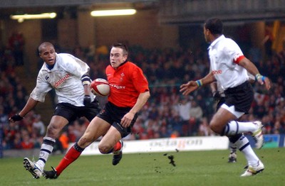 9-11-02 Wales v Fuji  Wales Rhys Williams splits the Fujian defence 