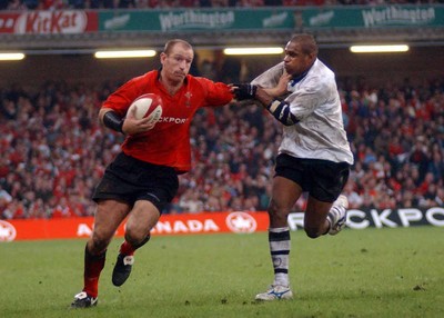 9-11-02 Wales v Fuji  Wales man of thematch Gareth Thomas hands off Fuji's Setareki Tawake  