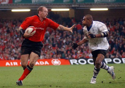 9-11-02 Wales v Fuji  Wales Gareth Thomas hands off Setareki Tawake. 