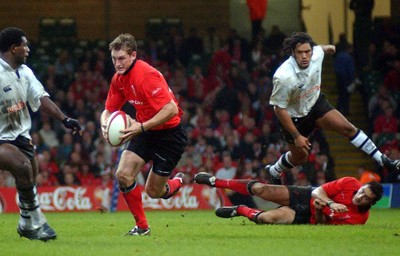 9-11-02 Wales v Fuji  Welsh centre Jamie Robinson runs at Fuji after taking a short pass from Sonny Parker.  