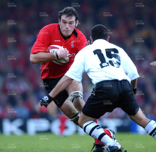 9-11-02. Wales v Fiji.  Wales' Robert Sidoli takes on Joseph Narruhn.  Picture: James Davies/