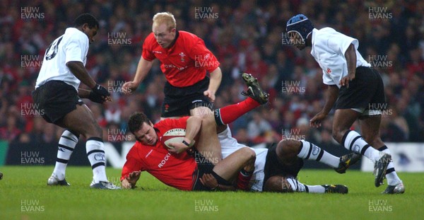 09.11.02  Wales v Fiji  Wales Mark Jones is tackled by Simon Raiwalui  