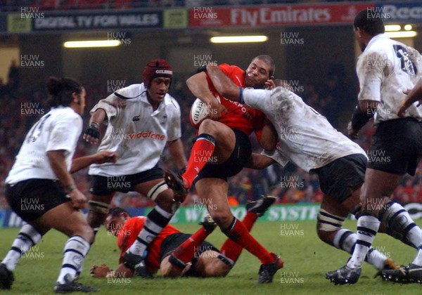 9-11-02 Wales v Fuji  Wales captain Colin Charvis is tackled by Fuji's lock forward Apisai Naevo  