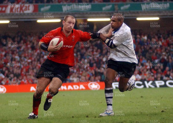 9-11-02 Wales v Fuji  Wales man of thematch Gareth Thomas hands off Fuji's Setareki Tawake  