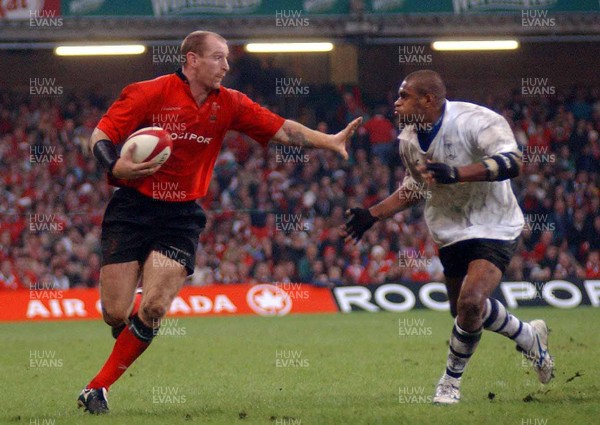 9-11-02 Wales v Fuji  Wales Gareth Thomas hands off Setareki Tawake. 