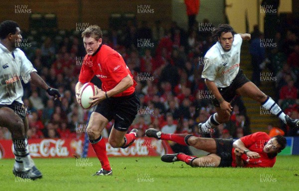 9-11-02 Wales v Fuji  Welsh centre Jamie Robinson runs at Fuji after taking a short pass from Sonny Parker.  