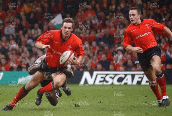 9-11-02 Wales v Fuji  Rhys williams looks on as Mark Jones is tackled short of the Fuji line. 