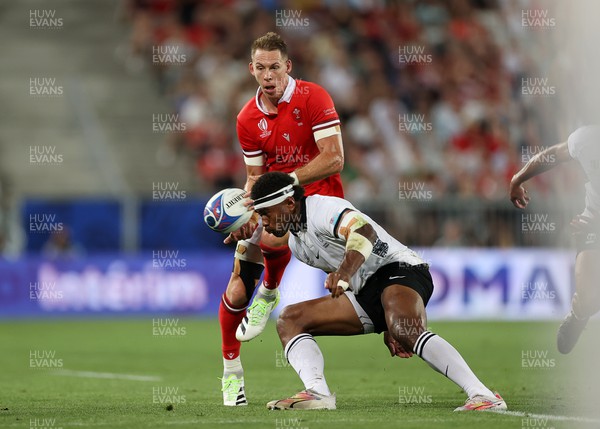 100923 - Wales v Fiji - Rugby World Cup 2023 - Pool C - Liam Williams of Wales is tackled by Vinaya Habosi of Fiji 