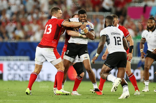 100923 - Wales v Fiji - Rugby World Cup 2023 - Pool C - Ilaisa Droasese of Fiji is tackled by George North of Wales 
