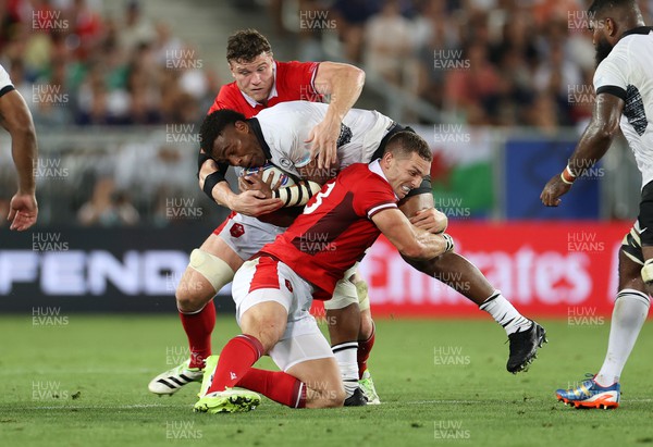 100923 - Wales v Fiji - Rugby World Cup 2023 - Pool C - Waisea Nayacalevu of Fiji is tackled by George North of Wales 