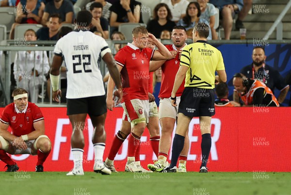 100923 - Wales v Fiji - Rugby World Cup 2023 - Pool C - Jac Morgan of Wales talks to Referee Matthew Carley 