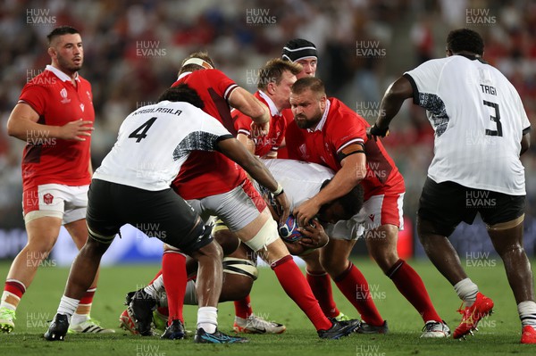100923 - Wales v Fiji - Rugby World Cup 2023 - Pool C - Tomas Francis of Wales makes a tackle alongside Nick Tompkins
