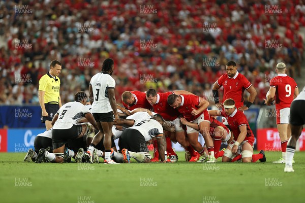 100923 - Wales v Fiji - Rugby World Cup 2023 - Pool C - Wales scrum with front row Tomas Francis, Ryan Elias and Gareth Thomas of Wales 