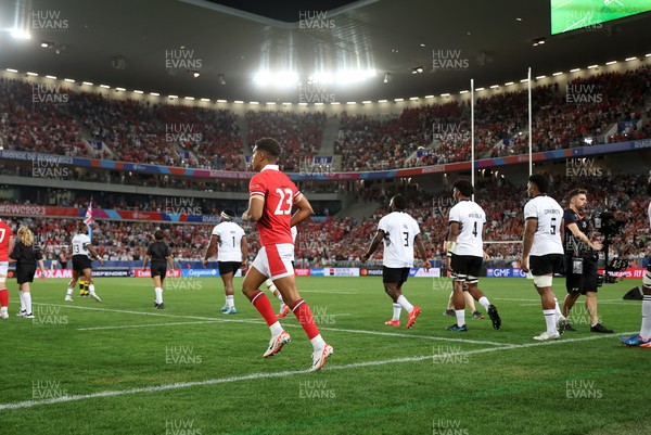 100923 - Wales v Fiji - Rugby World Cup 2023 - Pool C - Rio Dyer of Wales runs onto the field