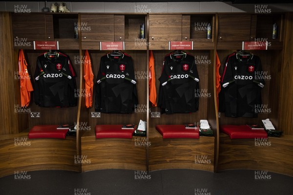 141121 - Wales v Fiji - Autumn Nations Series - Tomos Williams, Seb Davies, Christ Tshiunza and Dillon Lewis of Wales jersey hangs in the dressing room